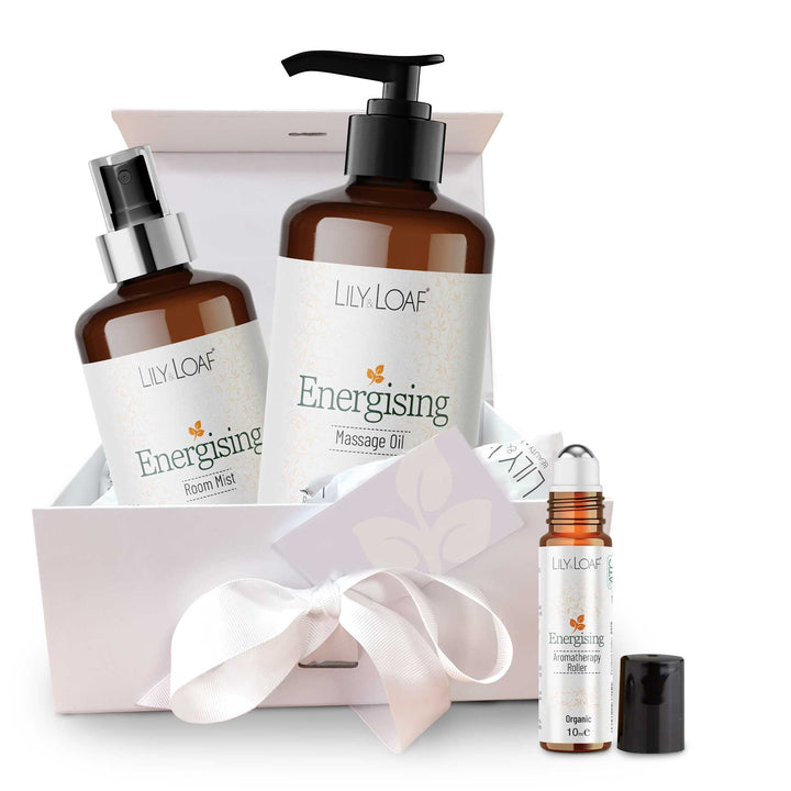 Lily Loaf product set including massage oil, room mist, and roller ball on a white background