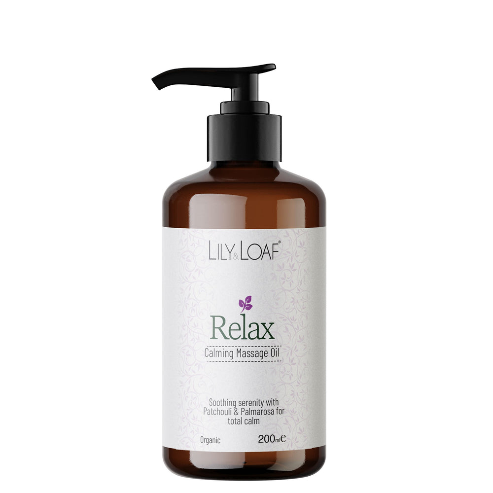 Bottle of Lily Loaf Relax Calming Massage Oil on a white background