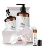 Lily & Loaf sleep product set with massage oil, pillow mist, and rollerball on a white background