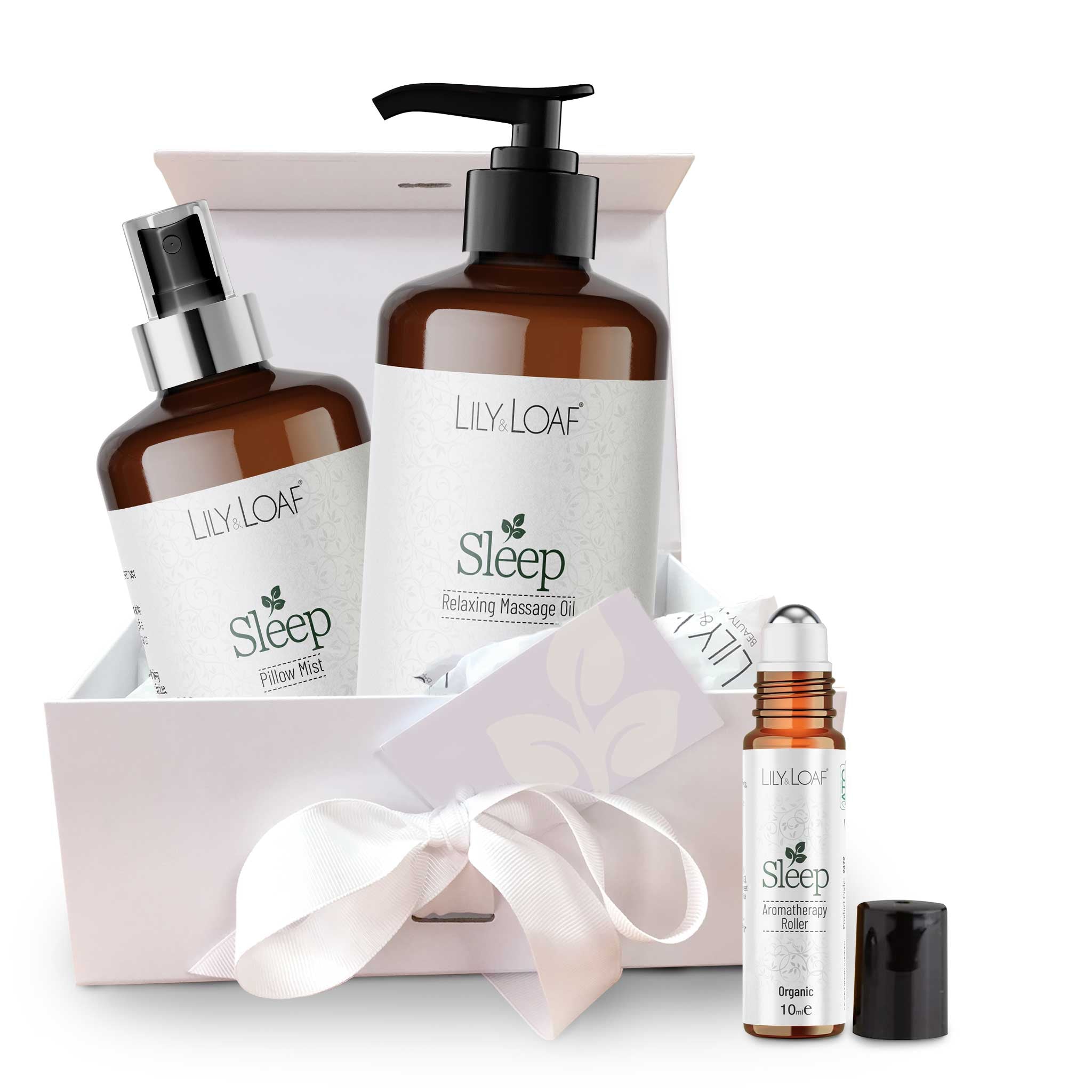 Lily & Loaf sleep product set with massage oil, pillow mist, and rollerball on a white background